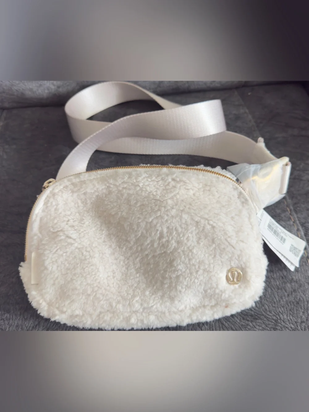 lululemon athletica Cream Faux Shearling Crossbody Pouch with Gold Logo